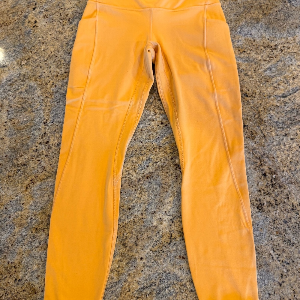 Lululemon Yellow double lined with side pockets. Size 6.